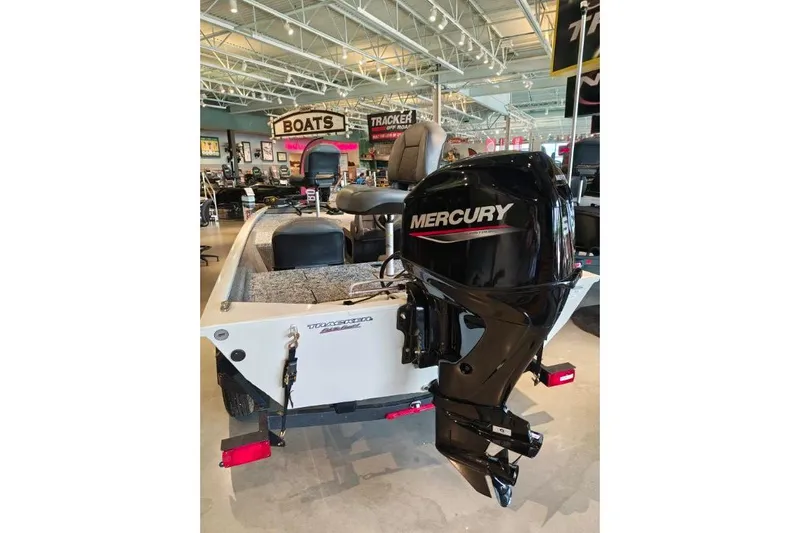 Slide: The Image of 2026 Tracker Pro 170 boat with Mercury engine displayed in showroom. - 6
