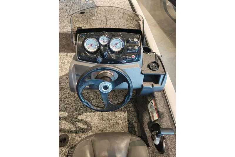 Slide: The Image of 2026 Tracker Pro 170 boat dashboard with steering wheel and instrument panel. - 7