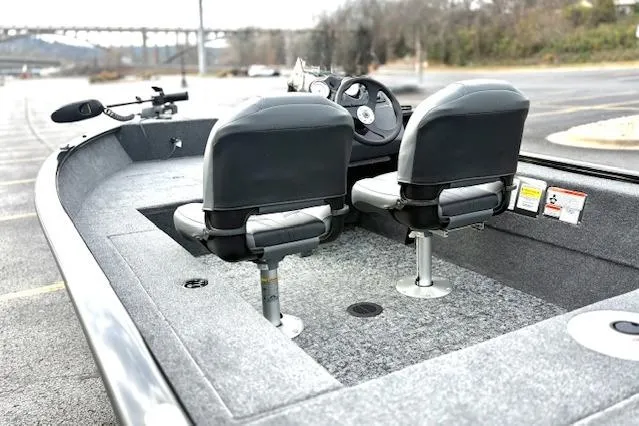 Slide: The Image of 2026 Tracker Super Guide V-16 SC boat interior with dual seats and steering console. - 59
