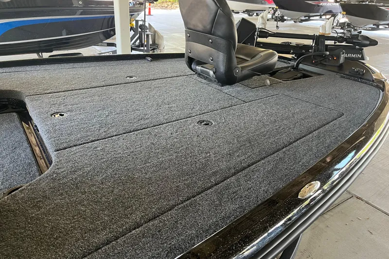 Slide: The Image of 2026 Nitro Z20 XL Pro boat interior with carpeted deck and seating. - 4