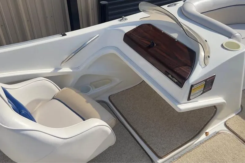 Slide: The Image of 2001 Harris-Kayot Star 20V boat interior with white seating and dashboard. - 14