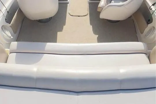 Slide: The Image of 2001 Harris-Kayot Star 20V boat interior with white seating and carpeted floor. - 15