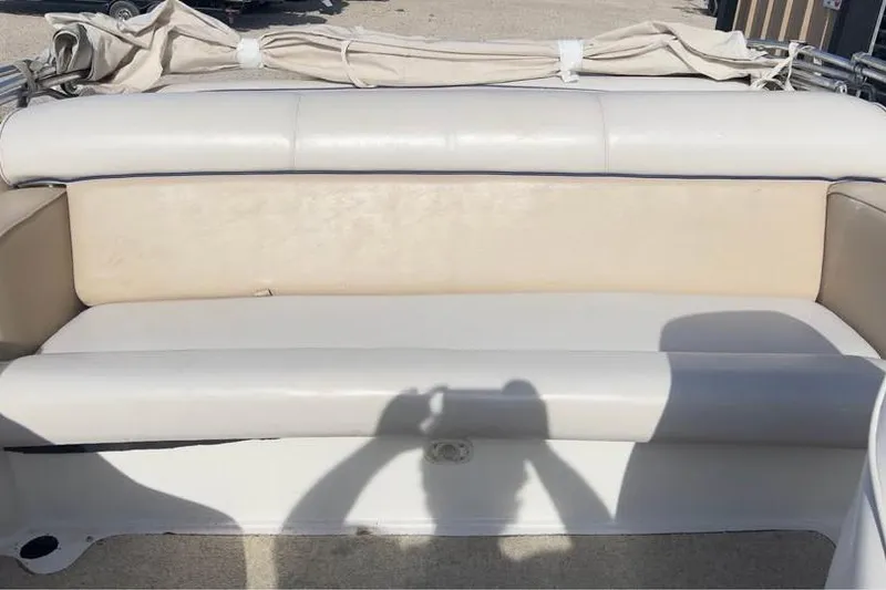 Slide: The Image of 2001 Harris-Kayot Star 20V boat interior with beige seating and shadows. - 5