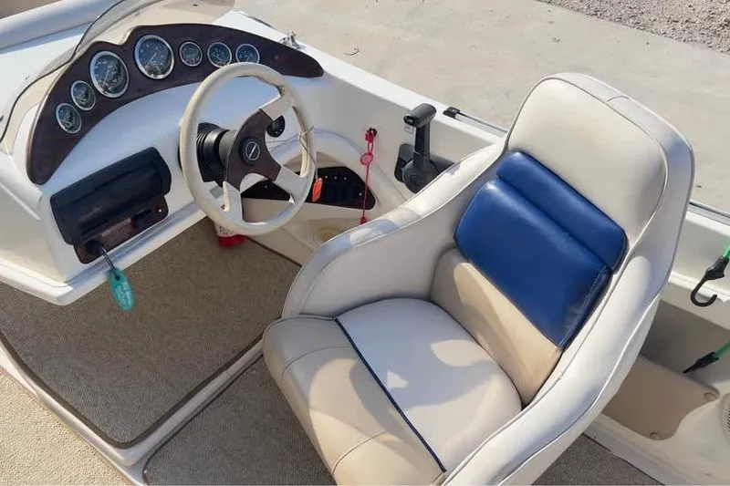 Slide: The Image of 2001 Harris-Kayot Star 20V boat interior with steering wheel and dashboard controls. - 6