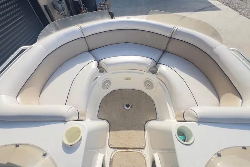 Slide: The Image of 2001 Harris-Kayot Star 20V boat interior with beige seating and carpeted floor. - 7