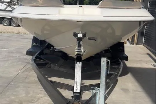 Slide: The Image of 2001 Harris-Kayot Star 20V boat on trailer, parked outdoors. - 8