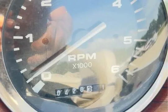 Slide: The Image of Close-up of a Harris-Kayot Star 20V 2001 RPM gauge showing 4,203.1 hours. - 9