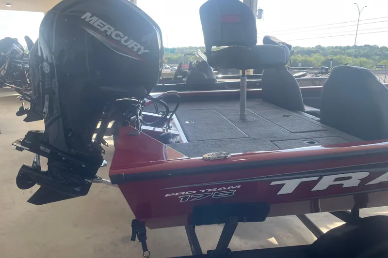 Slide: The Image of 2026 Tracker Pro Team 175 boat with Mercury engine, red exterior, and seating. - 2