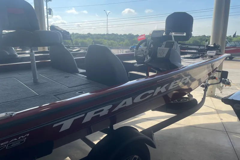 Slide: The Image of 2026 Tracker Pro Team 175 boat on trailer, side view in outdoor setting. - 3