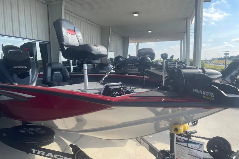 Slide: The Image of 2026 Tracker Pro Team 175 boat with Minn Kota Maxxum motor, displayed outdoors. - 4