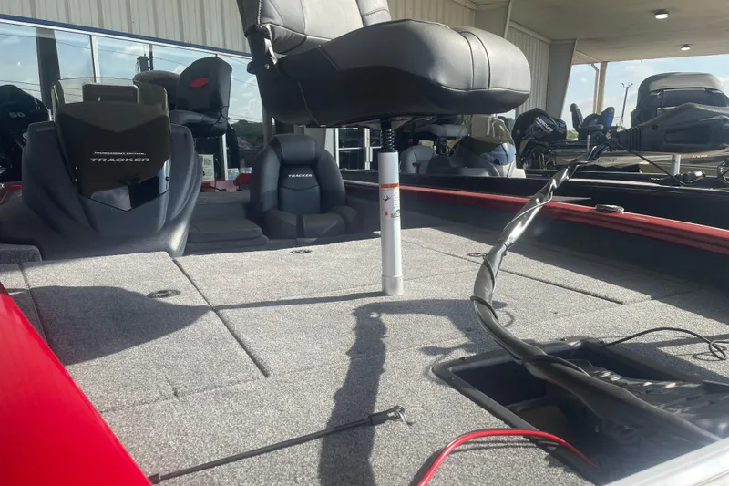 Slide: The Image of 2026 Tracker Pro Team 175 boat interior with seating and storage compartments. - 8