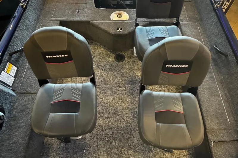 Slide: The Image of 2026 Tracker Pro Guide V-16 WT boat interior with four cushioned seats. - 4