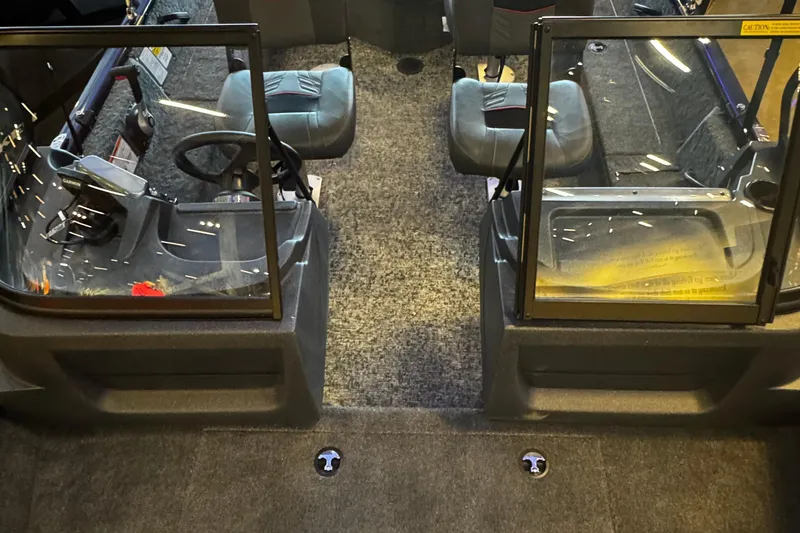 Slide: The Image of Interior view of 2026 Tracker Pro Guide V-16 WT boat with dual seats and steering console. - 5