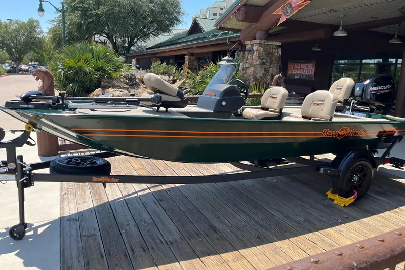 Slide: The Image of 2026 Tracker Bass Tracker Classic Limited boat on display outside a store. - 2