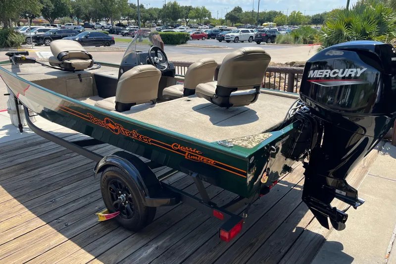Slide: The Image of 2026 Tracker Bass Tracker Classic Limited boat with Mercury engine on trailer. - 3