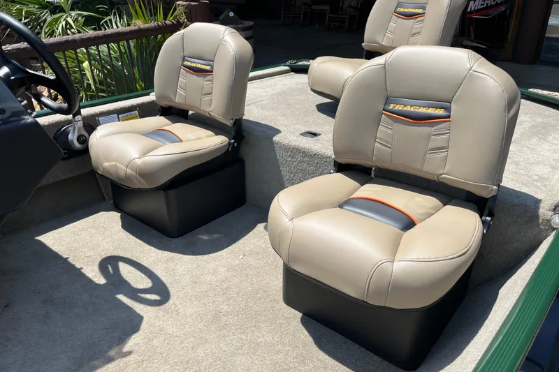 Slide: The Image of 2026 Tracker Bass Tracker Classic Limited boat seats, beige with black and orange accents. - 5