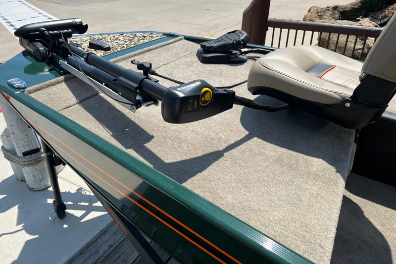 Slide: The Image of 2026 Tracker Bass Tracker Classic Limited boat deck with seating and trolling motor. - 6