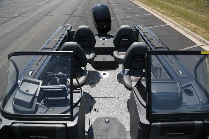 Slide: The Image of 2026 Tracker Targa V-18 Combo boat interior with seating and console view. - 3