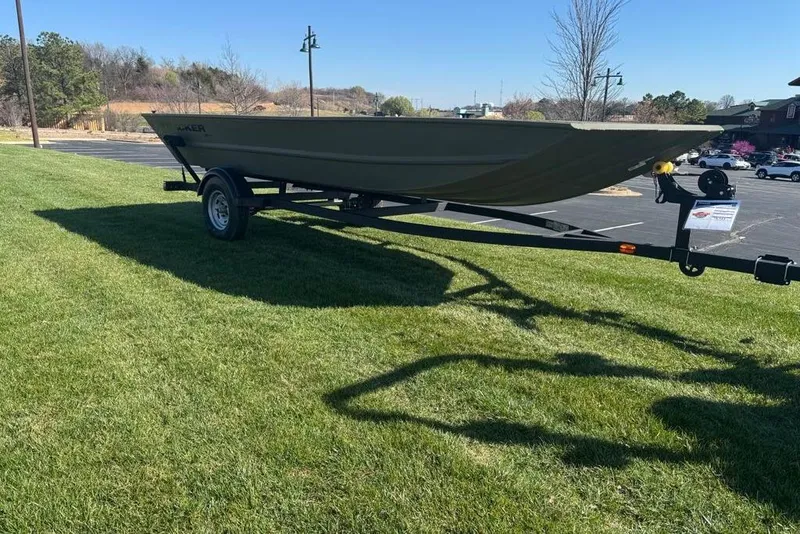 Slide: The Image of 2026 Tracker Grizzly 1754 Utility boat on trailer, parked on grass under clear sky. - 3