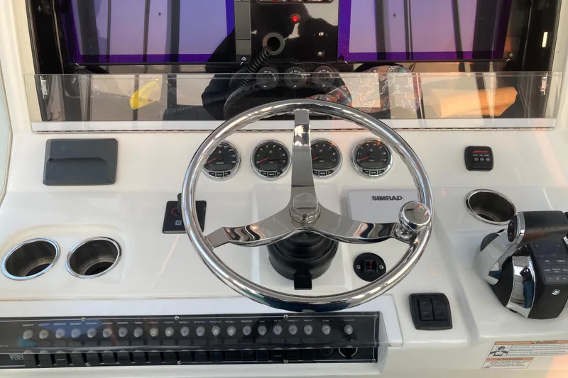 Slide: The Image of Control panel of a 2017 SeaVee 370z boat with steering wheel and gauges. - 10