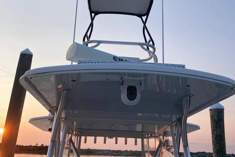 Slide: The Image of 2017 SeaVee 370z boat with tower, docked at sunset. - 13