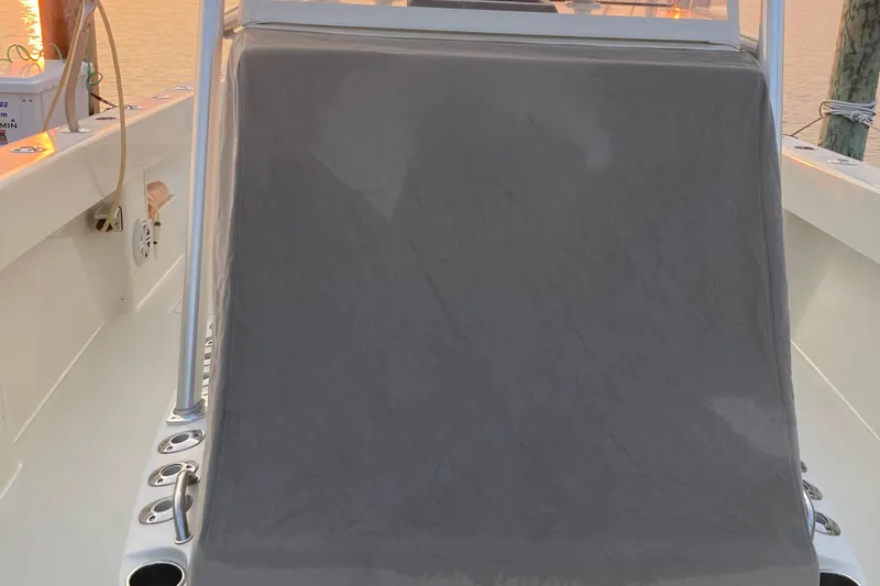 Slide: The Image of 2017 SeaVee 370z boat console with rod holders at sunset. - 16