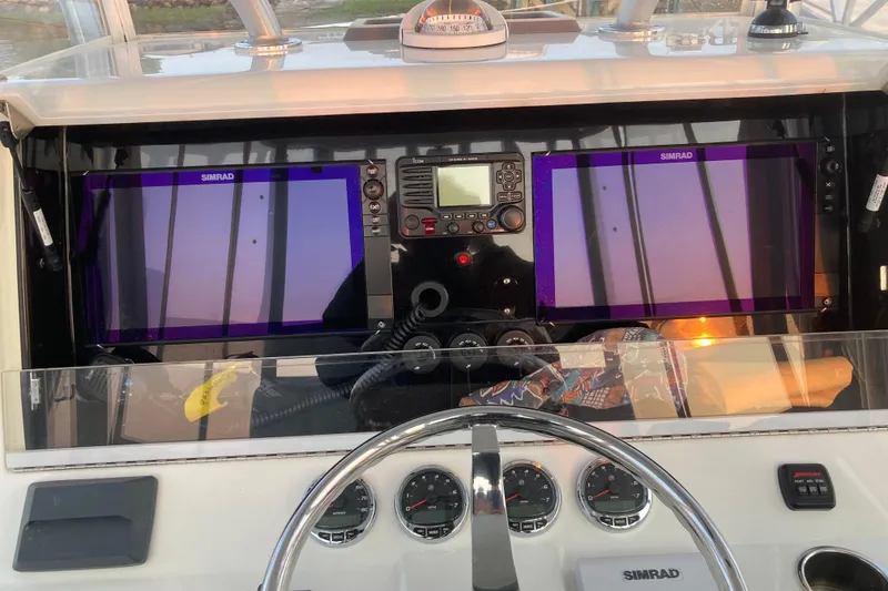 Slide: The Image of Control panel of a 2017 SeaVee 370z boat with Simrad displays. - 9