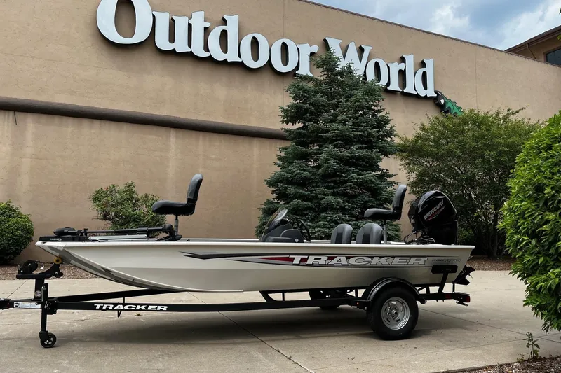 The Image of 2026 Tracker Pro 170 boat on trailer outside Outdoor World store. - 0