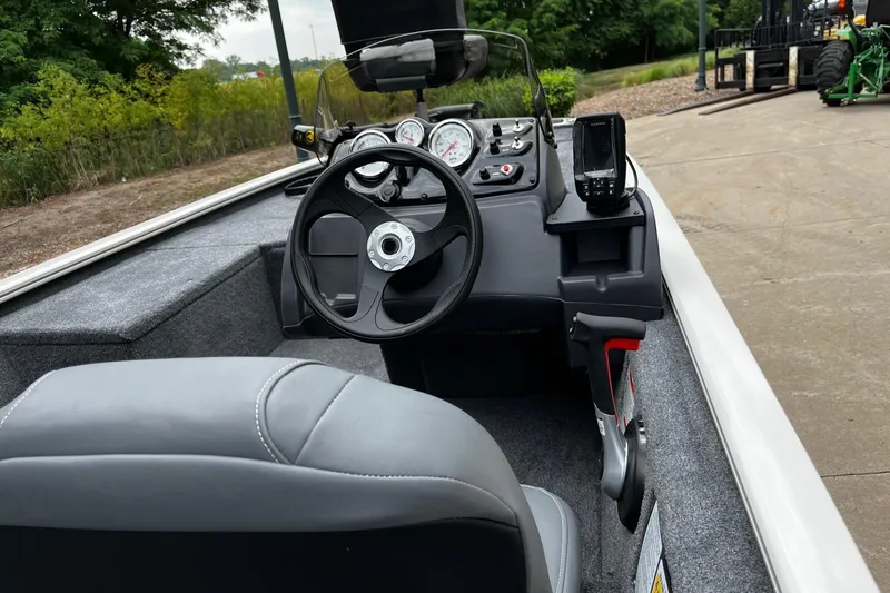 Slide: The Image of 2026 Tracker Pro 170 boat interior with steering wheel and control panel. - 2