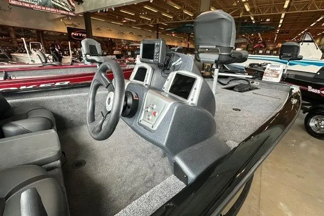Slide: The Image of 2026 Tracker Pro Team 175 boat interior with steering wheel and control panel. - 3