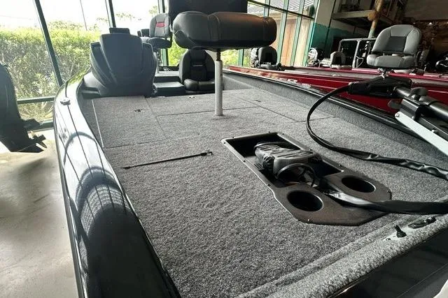 Slide: The Image of 2026 Tracker Pro Team 175 boat interior with carpeted deck and seating. - 4