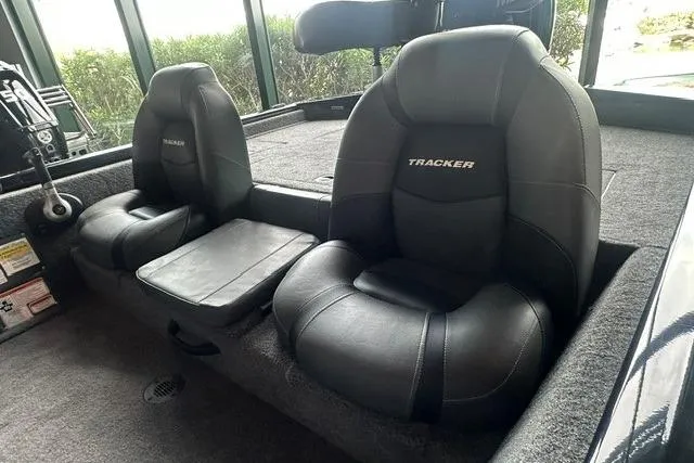 Slide: The Image of 2026 Tracker Pro Team 175 boat interior with black cushioned seats. - 10