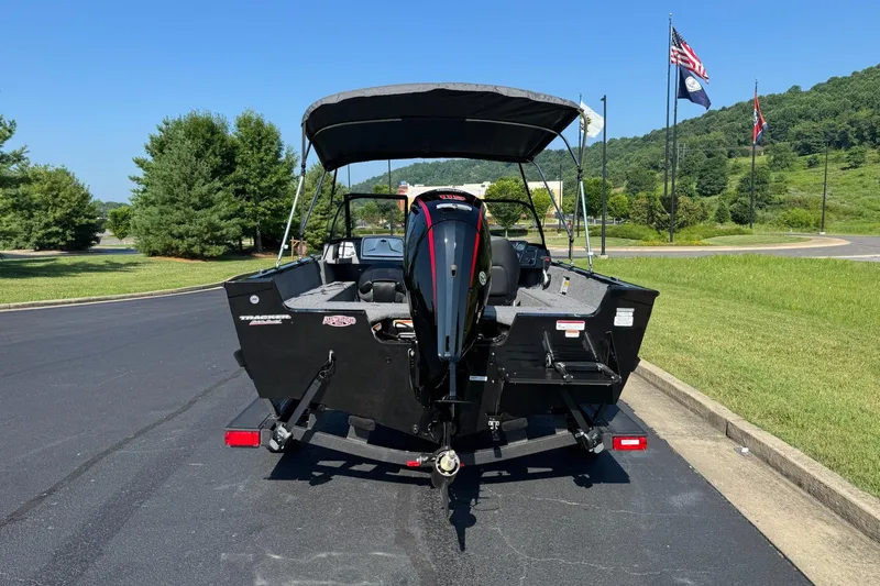 Slide: The Image of 2026 Tracker Pro Guide V-175 WT boat on a trailer, parked outdoors. - 3