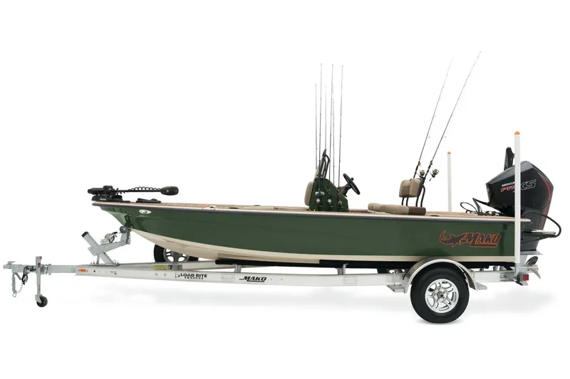 Slide: The Image of 2026 Mako 18 Pro Skiff Backwater Edition boat on trailer in parking lot. - 2