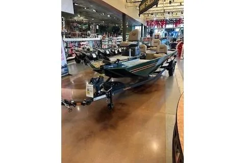 Slide: The Image of 2026 Tracker Bass Tracker Classic Limited boat displayed in a showroom. - 39