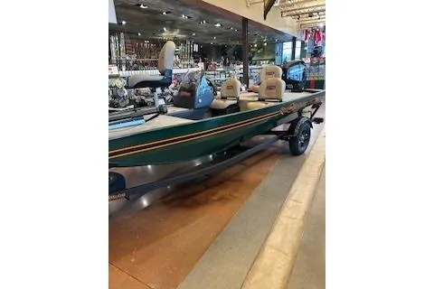 Slide: The Image of 2026 Tracker Bass Tracker Classic Limited boat displayed in a showroom. - 43