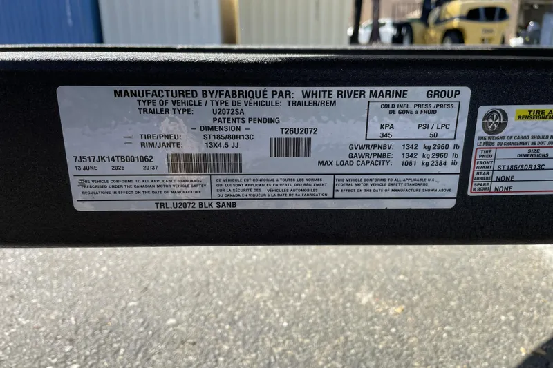 Slide: The Image of Label on 2026 Tracker Grizzly 2072 Utility trailer, detailing specifications and manufacturing information. - 26