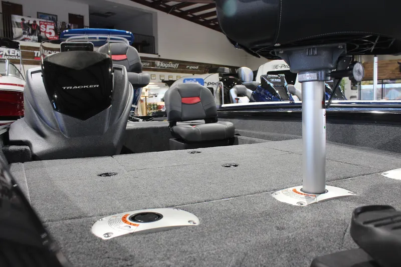 Slide: The Image of 2026 Tracker Pro Team 175 Crappie Edition boat interior with seating and carpeted deck. - 14