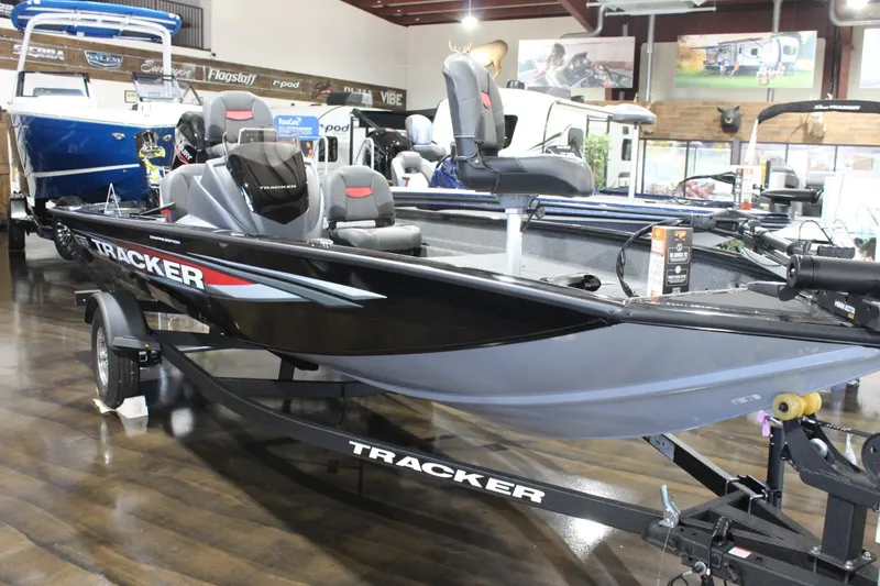 Slide: The Image of 2026 Tracker Pro Team 175 Crappie Edition boat displayed indoors on a trailer. - 2