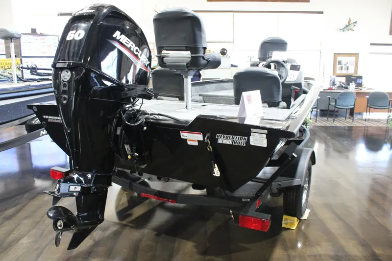 Slide: The Image of 2026 Tracker Pro Team 175 Crappie Edition boat with Mercury engine in showroom. - 3