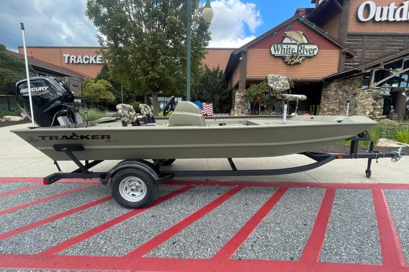 The Image of 2026 Tracker Grizzly 1754 SC boat on trailer outside White River Fly Shop. - 0