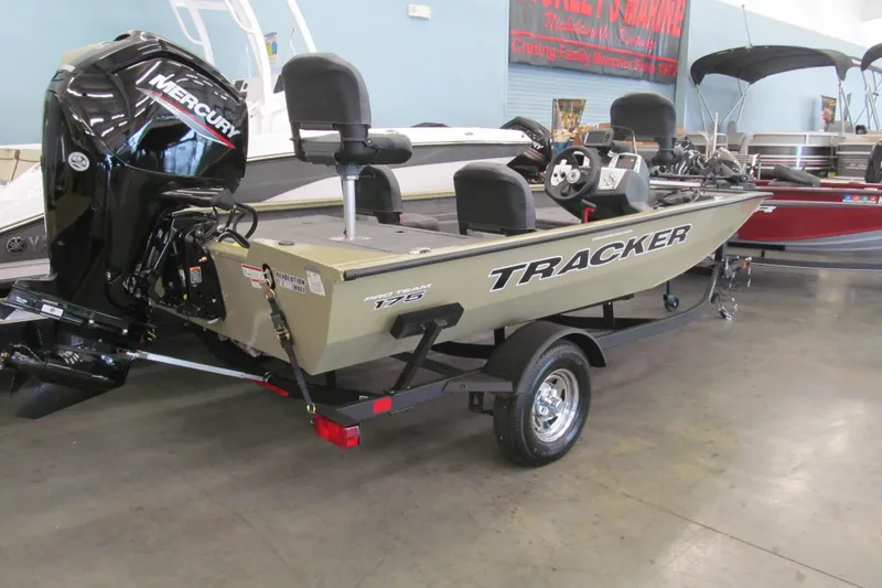 Slide: The Image of 2026 Tracker Pro Team 175 Crappie Edition boat with Mercury engine in showroom. - 2