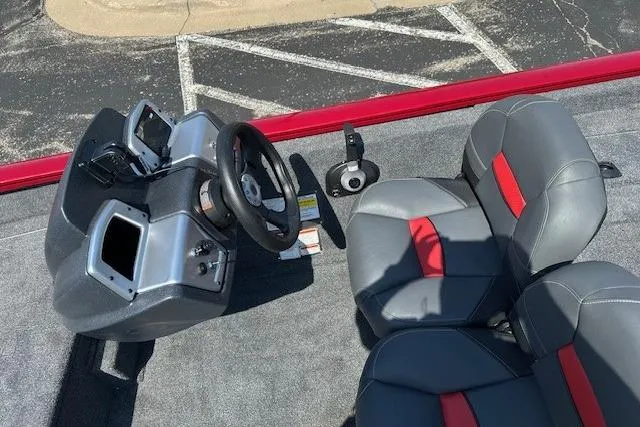 Slide: The Image of 2026 Tracker Pro Team 175 Crappie Edition boat interior with steering console and seating. - 6