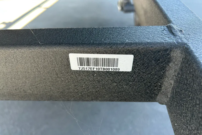 Slide: The Image of Barcode on 2026 Tracker Grizzly 1648 Utility, displaying serial number 7J517EF10TB001089. - 24