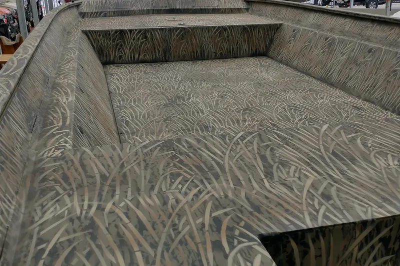 Slide: The Image of 2026 Tracker GRIZZLY 2072 Utility boat with camouflage interior design. - 2