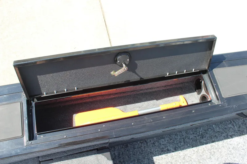 Slide: The Image of Storage compartment of 2026 Tracker Targa V-18 Combo boat with safety equipment. - 23