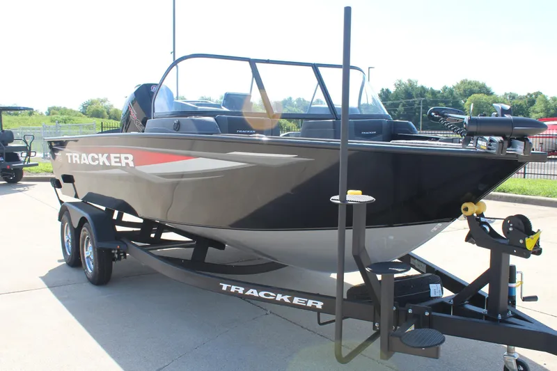Slide: The Image of 2026 Tracker Targa V-18 Combo boat on trailer, parked outdoors. - 5