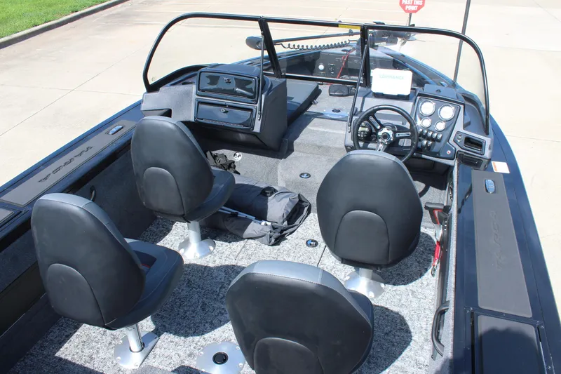 Slide: The Image of 2026 Tracker Targa V-18 Combo boat interior with four seats and control panel. - 8