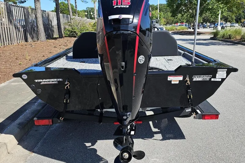 Slide: The Image of 2026 Tracker Pro Team 190 boat with powerful outboard motor, parked outdoors. - 3