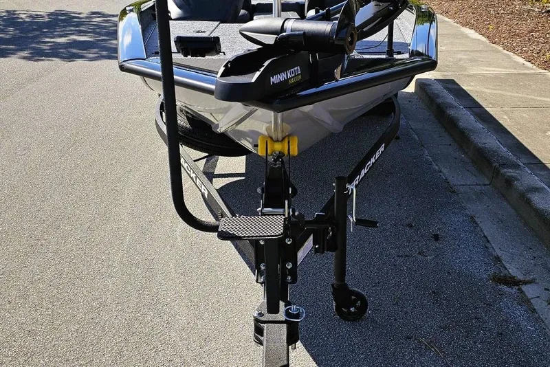 Slide: The Image of 2026 Tracker Pro Team 190 boat on trailer, parked on a street. - 5